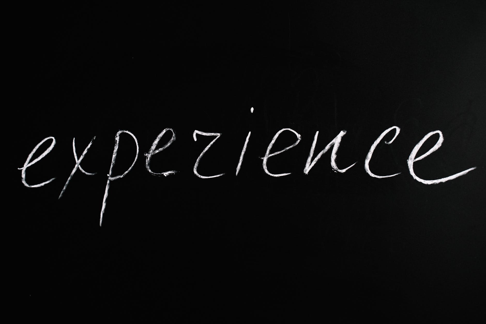 experience lettering text on black background